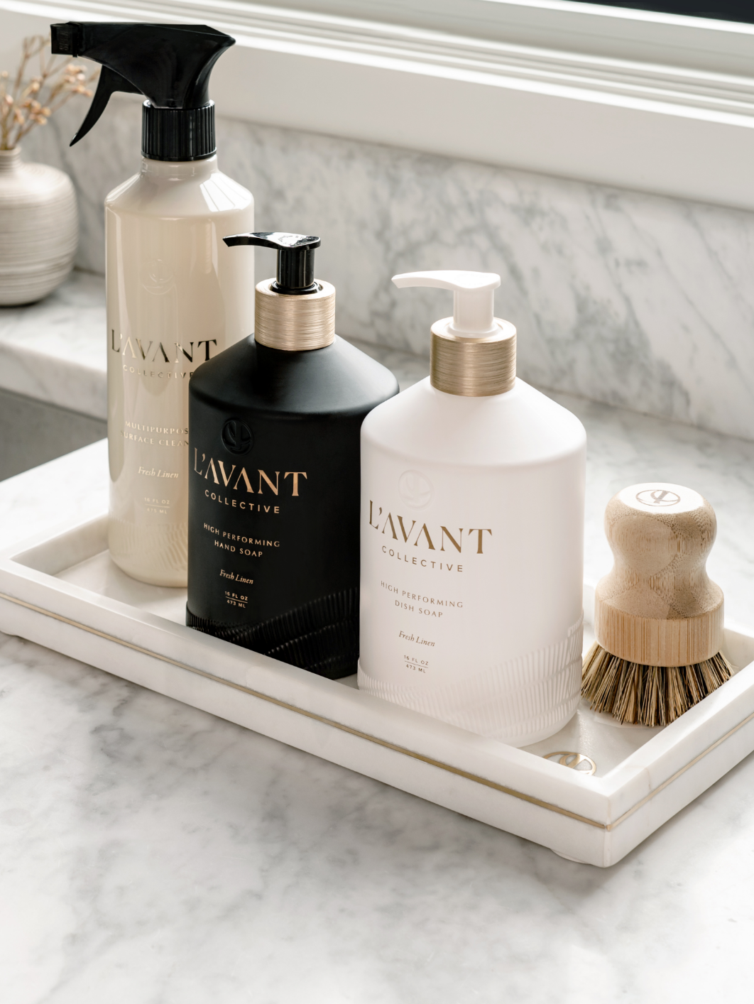https://lavantcollective.com/cdn/shop/files/L_AVANTLuxuryWhiteMarbleTraywithBrassLogo_with_hand_soap_and_dish_soap_fresh_linen_2048x.png?v=1742927491