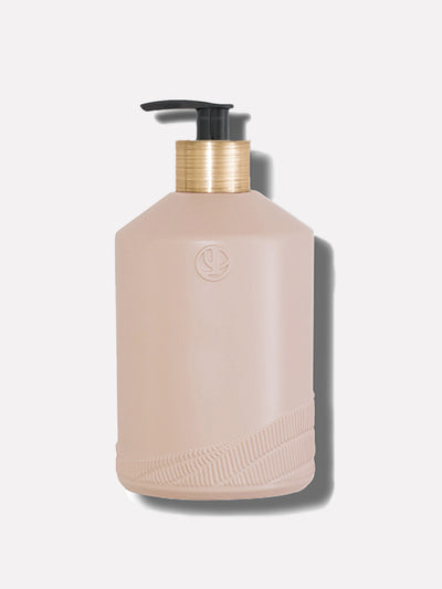 Blush pink dispenser bottle with black pump