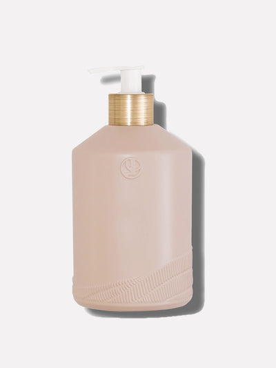 Blush pink empty soap bottle with white pump