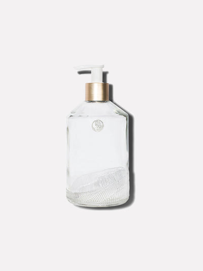 Clear, custom, 10 oz,  glass bottle, with white pump and gold neck.