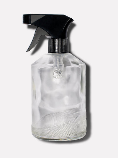 Clear glass custom bottle with a black sprayer top